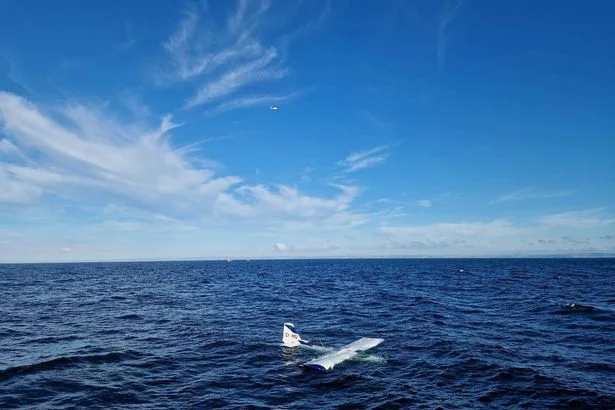 Plane crash lands in Irish Sea as crew found floating on wing
