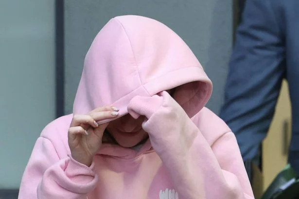 Law student wears 'faith over fear' t-shirt as she appears in court over bomb charge