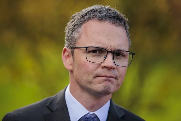 Minister Patrick O’Donovan rushed to hospital in Belgium after becoming unwell