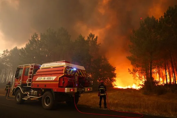 Thousands of tourists evacuated as 'firenado' rips through French holiday spot