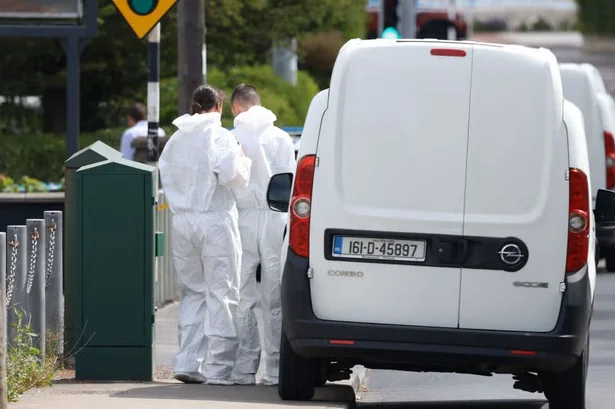 In photos: Gardaí and forensics are on the scene in Dún Laoghaire where a man was shot dead
