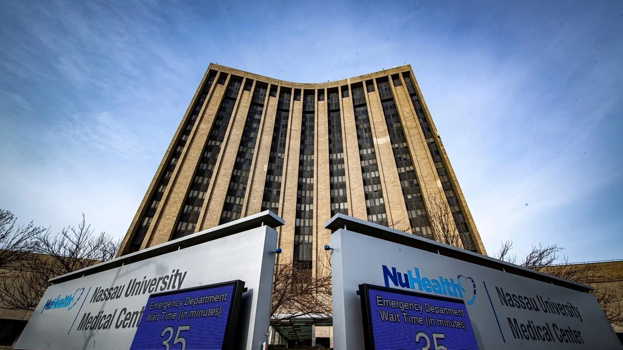 Why is NUMC using captive insurance set up in the Cayman Islands?